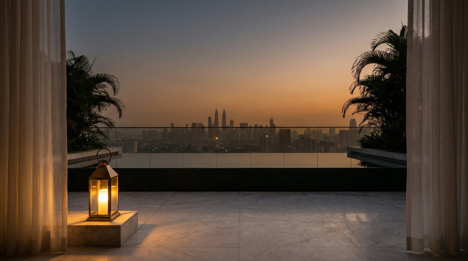 A rooftop pool terrace at dusk with the Kuala Lumpur skyline